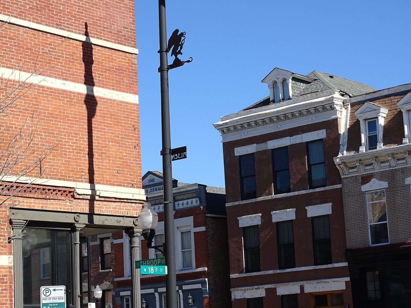 Brick buildings on a street corner in Chicago's Pilsen neighborhood.