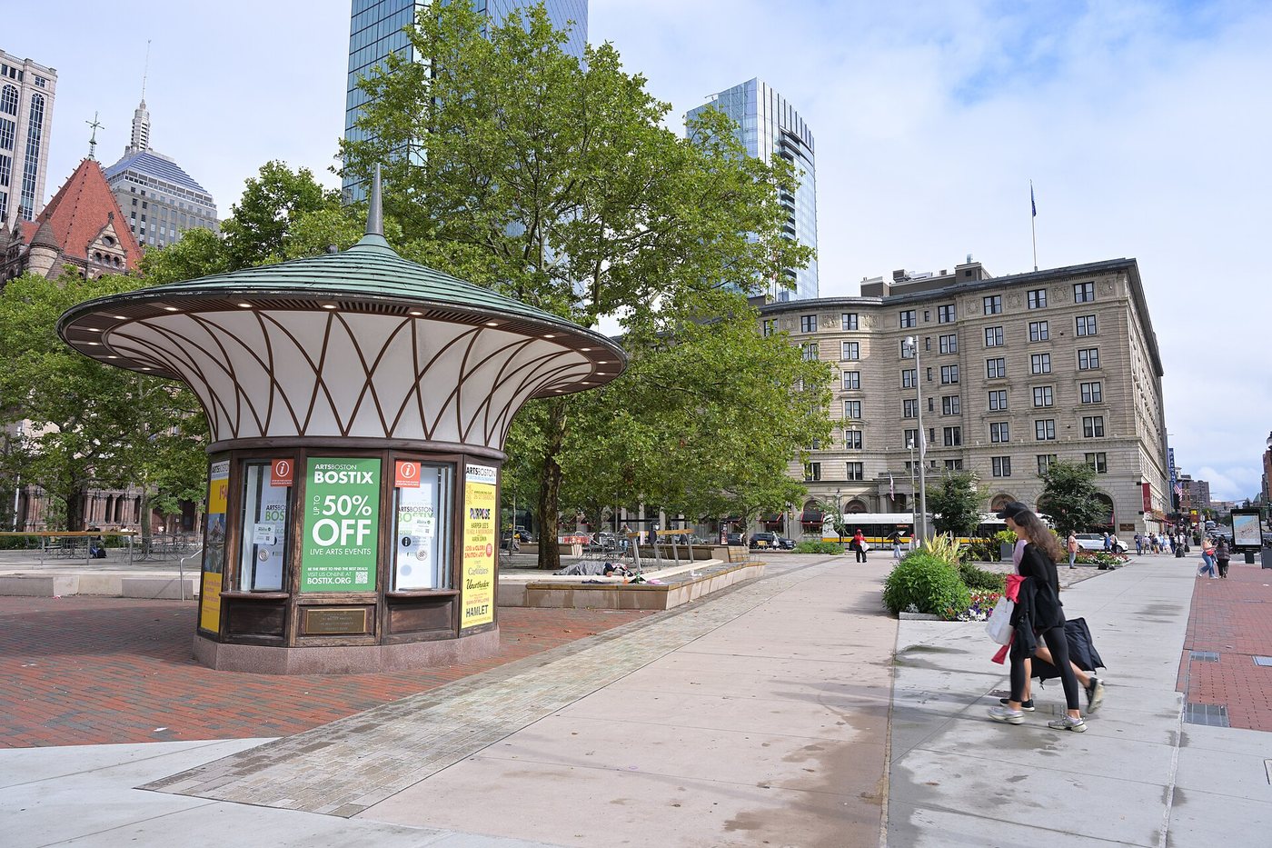 A kiosk and pedestrian paths in Boston's Copley Square.