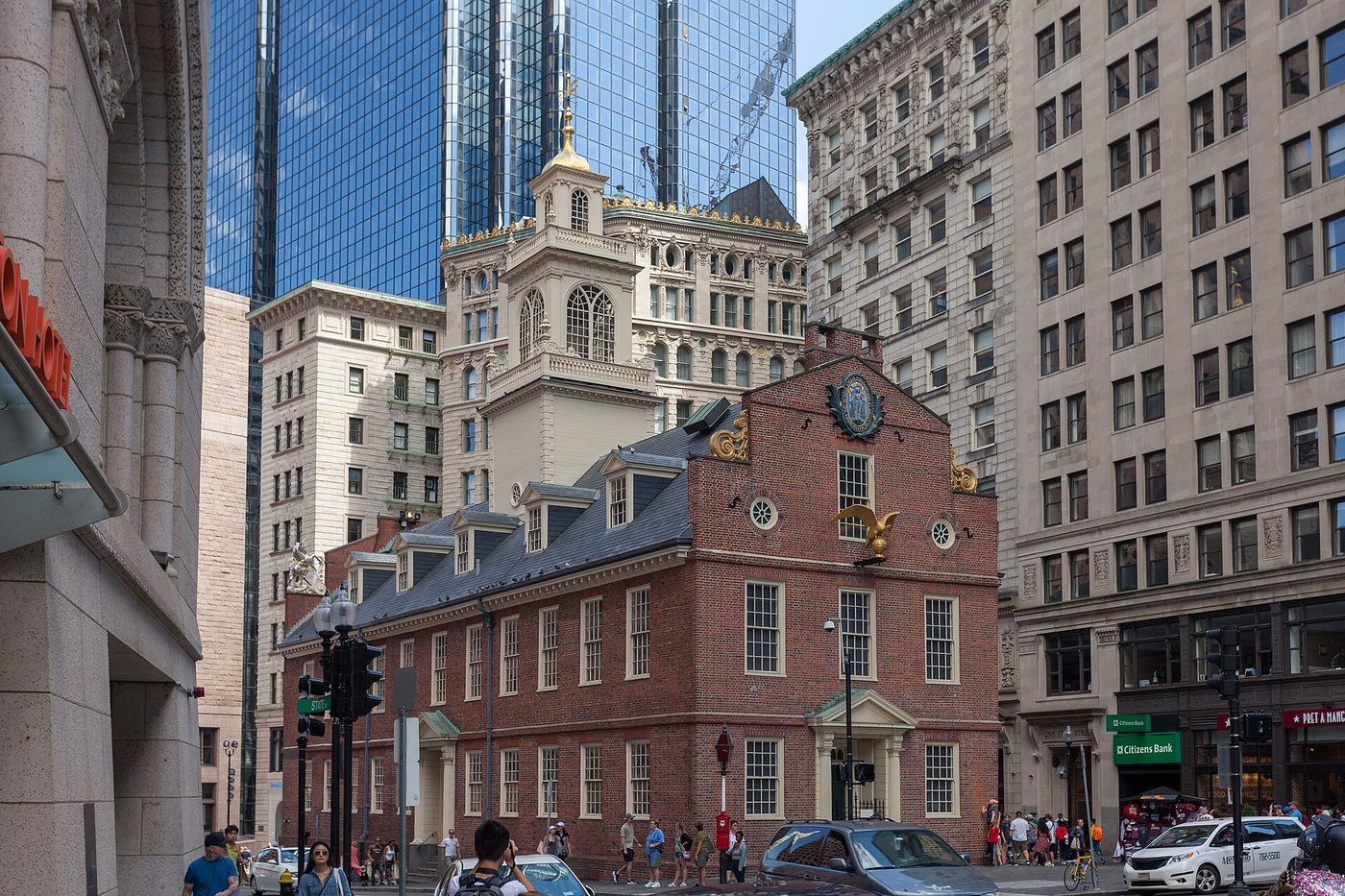 Boston's Old State House surrounded by taller downtown buildings.
