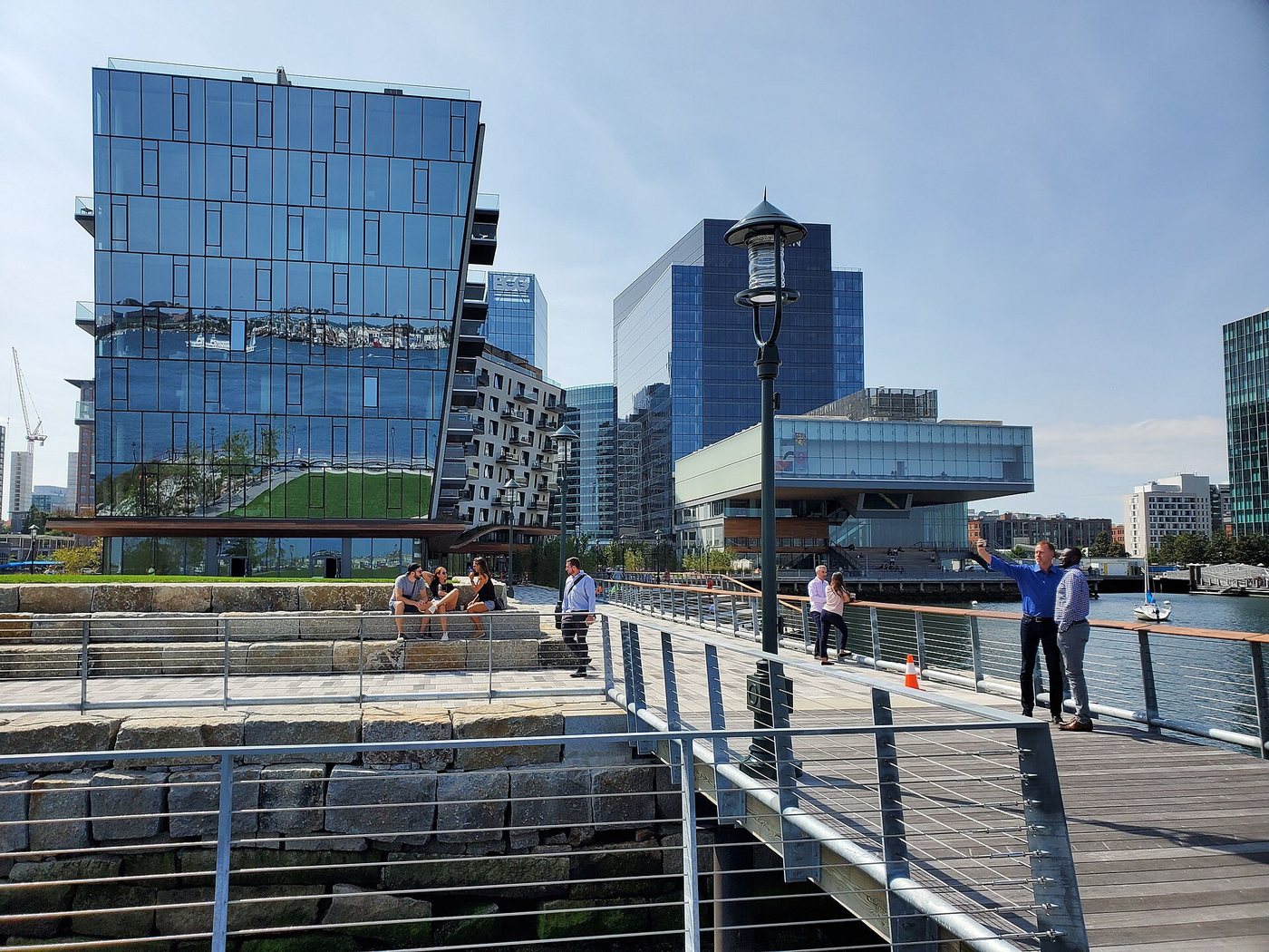 The Harborwalk at Pier 4 beside Boston's waterfront buildings.
