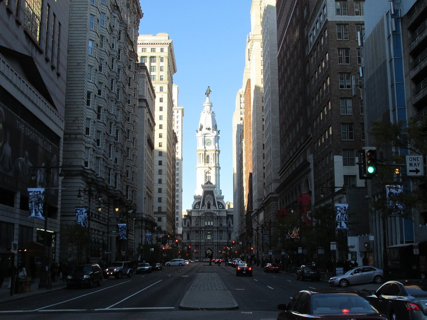 Philadelphia City Hall seen along a downtown street.