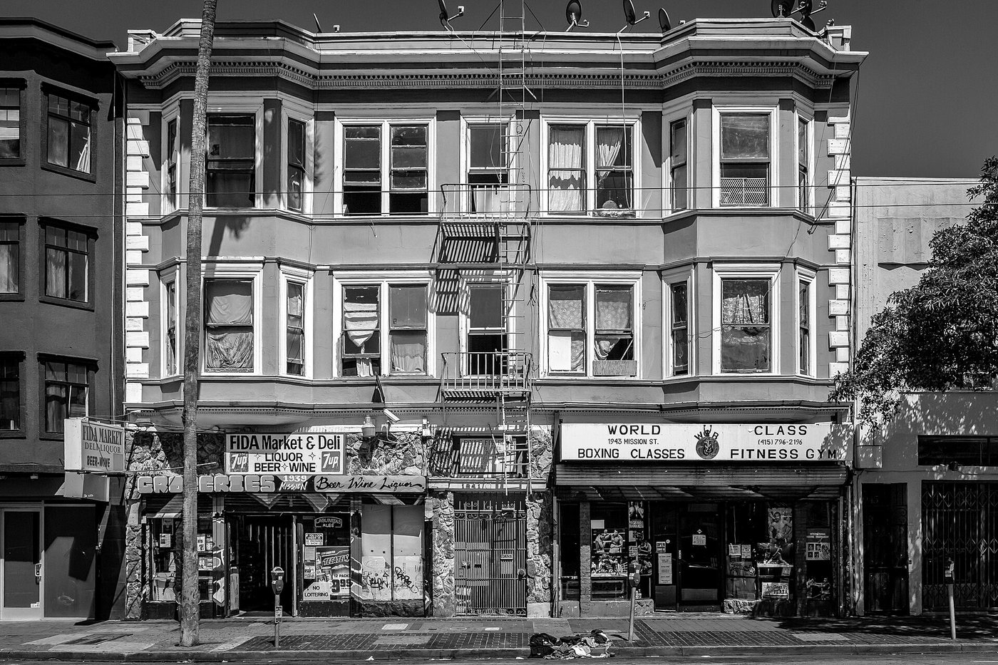 Shopfronts and upper-story windows in San Francisco's Mission District.