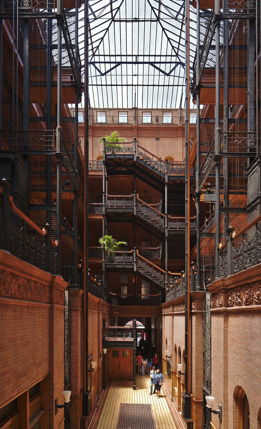 Stairs, ironwork and the skylit interior of the Bradbury Building.