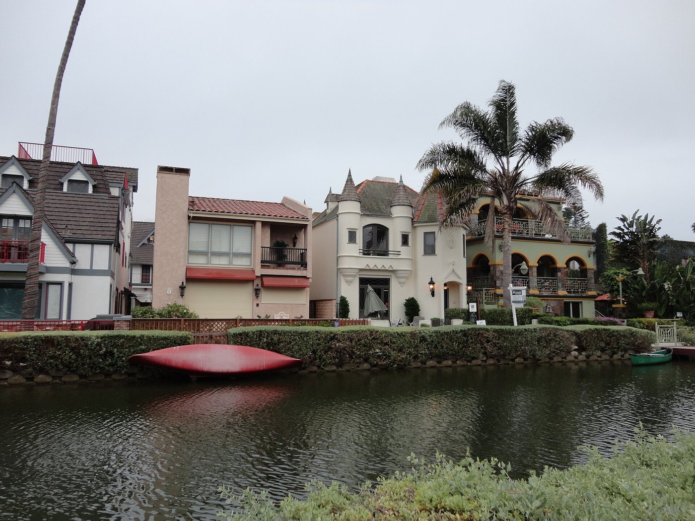 Homes and gardens lining a Venice canal in Los Angeles.