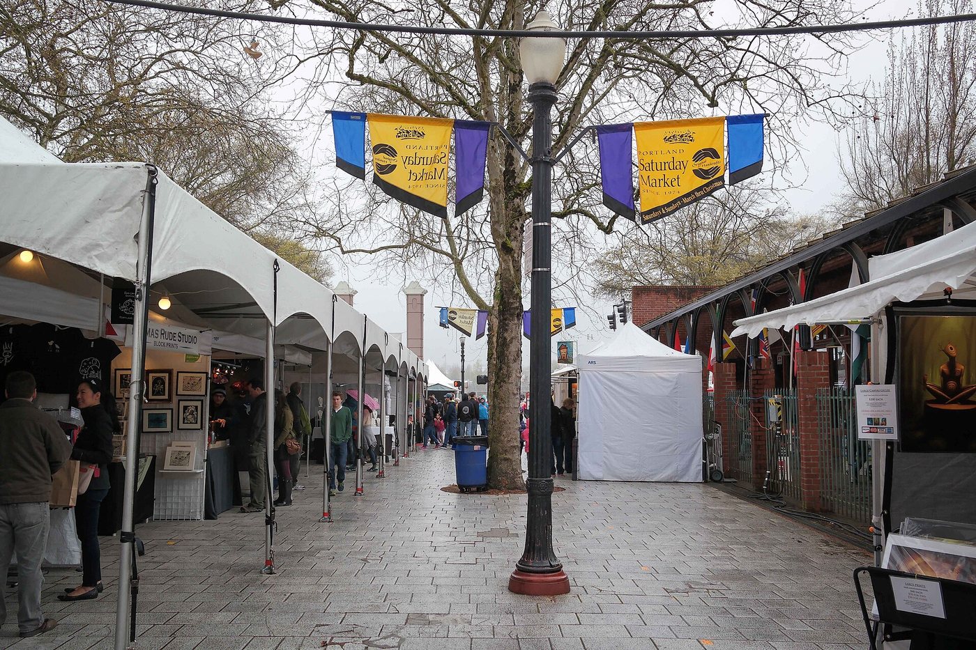 Stalls beneath the structures at Portland Saturday Market.