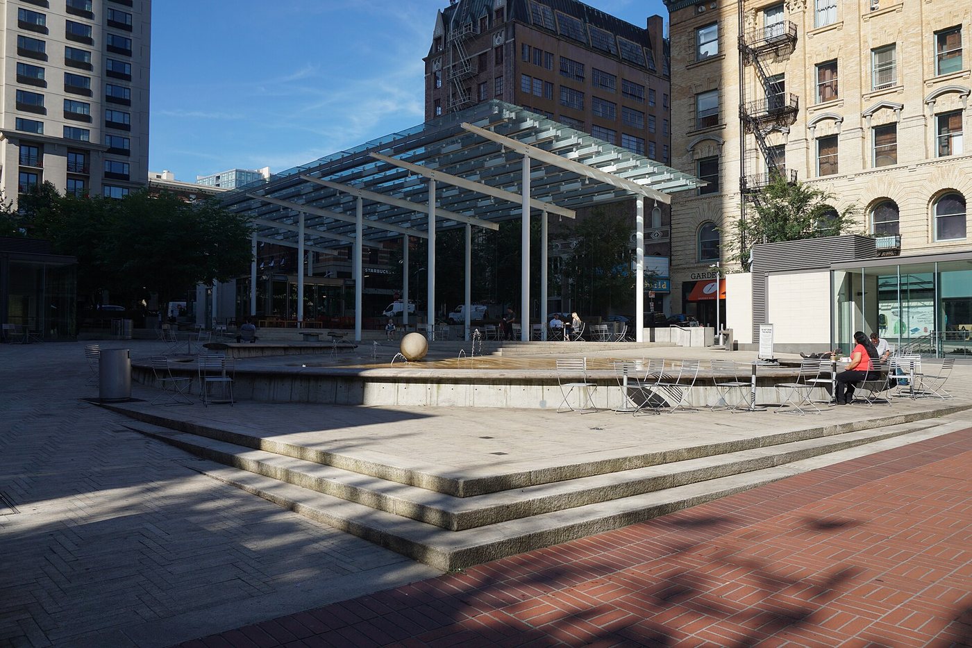 The paved public space and canopy at Director Park in Portland.