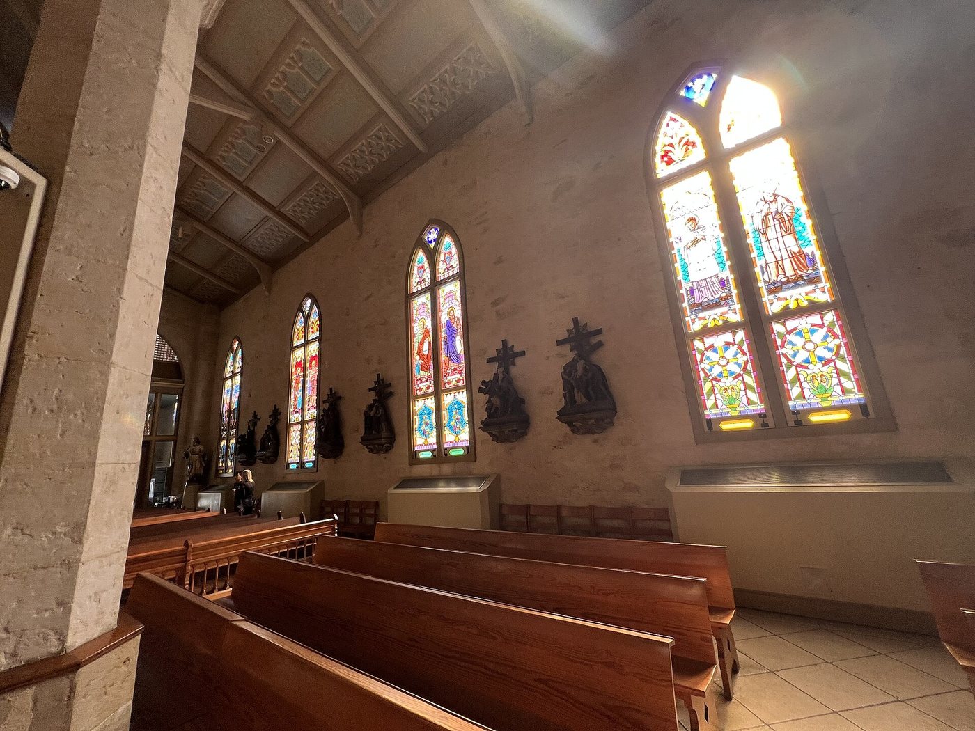 Pews and stained-glass windows inside San Fernando Cathedral.