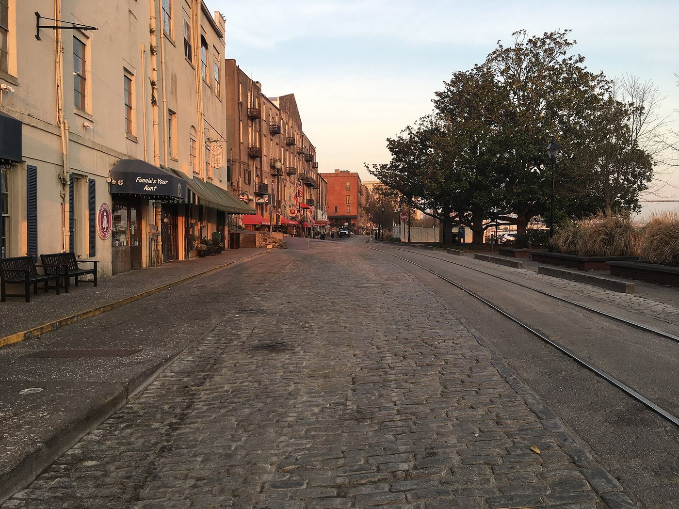 Warehouse facades and paving along Savannah's River Street.