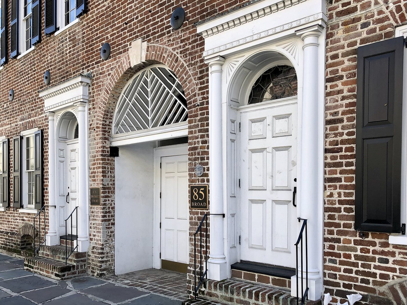 Historic doorways along Broad Street in Charleston's French Quarter.