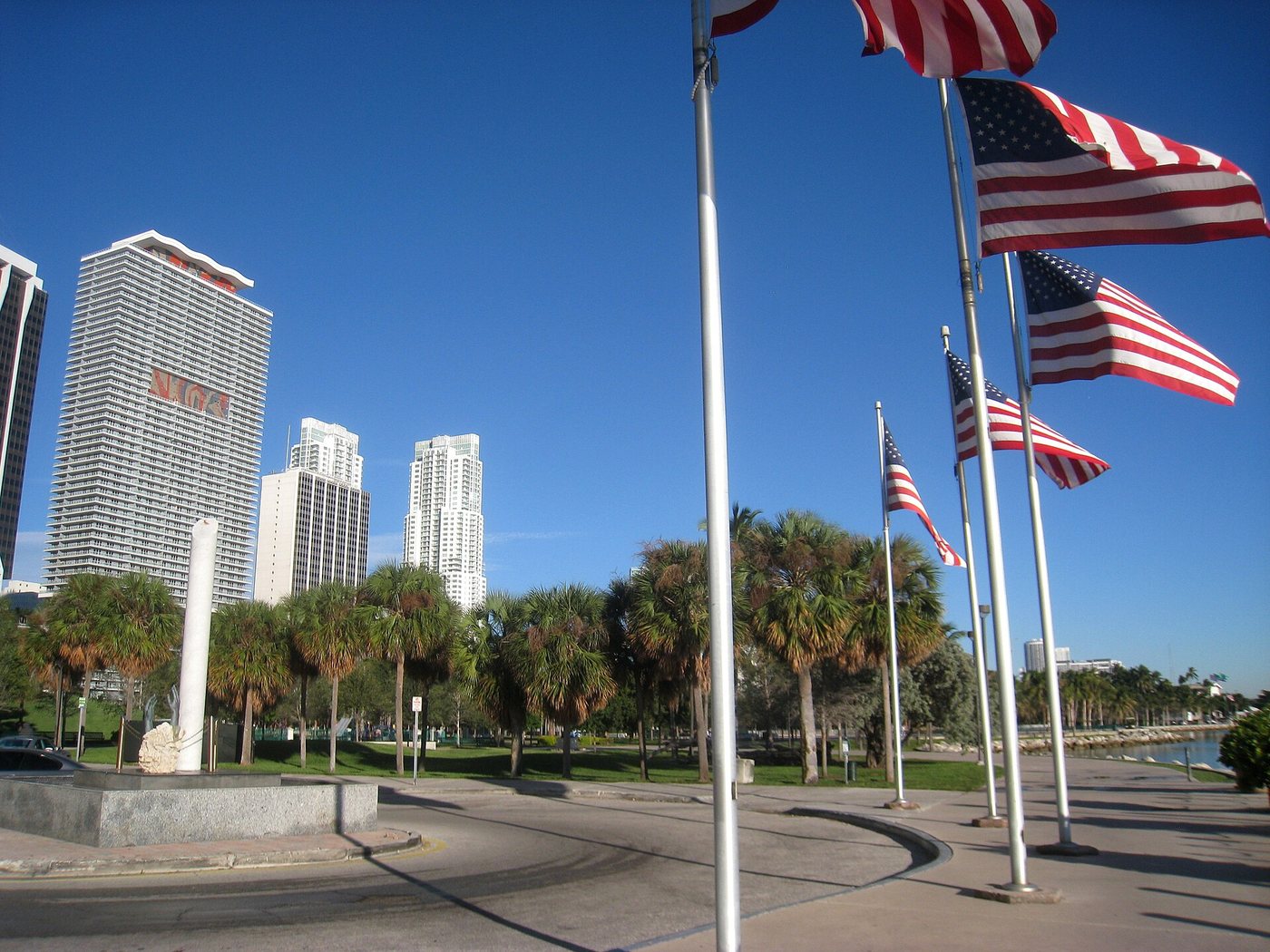 Flagpoles and open paths at Miami's Bayfront Park.